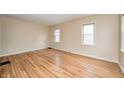Spacious living room featuring hardwood floors, neutral paint, and bright natural light at 1231 Nester St, Speedway, IN 46224