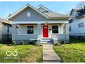 Home features a well-maintained front yard, inviting entrance, and classic architectural style at 1510 W 22Nd St, Indianapolis, IN 46202