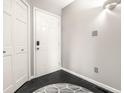 Welcoming entryway with tiled floor, coat closet and neutrally painted walls at 2141 Rome Dr # Apt B, Indianapolis, IN 46228