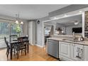 Cozy kitchen with stainless steel appliances, granite counters, and a connected dining area at 2253 Mullinix Rd, Greenwood, IN 46143