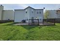 A spacious backyard features a two level wood deck and large lawn at 2348 Shadowbrook Dr, Plainfield, IN 46168