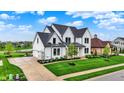 Beautiful two-story home with a large driveway and well-manicured lawn at 284 Chatham Hills Blvd, Westfield, IN 46074