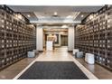 Elegant lobby area with patterned wallpaper, tiled floors, modern seating, and contemporary lighting at 333 Massachusetts Ave # 204, Indianapolis, IN 46204