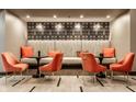 Cozy lounge area with plush seating, accent pillows, decorative wallpaper, and stylish side tables at 333 Massachusetts Ave # 204, Indianapolis, IN 46204