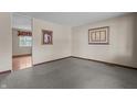 Neutral carpeted living room with a view to the hallway at 3561 Winings Ave, Indianapolis, IN 46221