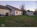 View of a large backyard featuring a patio, shed, and plenty of green space at 4036 Fairoaks Ct, Franklin, IN 46131