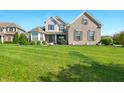 Attractive two-story home with brick and siding, showcasing a green lawn and curb appeal at 4707 Branch View Way, Indianapolis, IN 46234