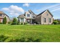 Beautiful two-story brick home with a well-manicured lawn and professional landscaping at 4707 Branch View Way, Indianapolis, IN 46234