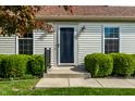 Close-up of front entrance displaying tidy landscaping and updated front door at 8142 Bittern Ln, Indianapolis, IN 46256