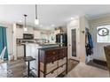 A spacious open kitchen with an island, modern appliances, and ample countertop space at 1040 Iowa St, Columbus, IN 47201