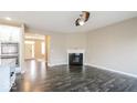 Comfortable living room featuring hardwood floors and a classic fireplace design at 10448 Pintail Ln, Indianapolis, IN 46239