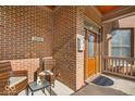 Inviting front porch with brick wall, seating area, and a warm welcome at 1510 Central Ave, Indianapolis, IN 46202