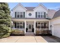Inviting front porch with comfortable seating and hanging plants, creating a welcoming entrance at 16726 Blackbird Ct, Noblesville, IN 46060