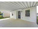 Inviting covered porch featuring a gray front door, perfect for relaxing outdoors at 2333 Calhoun St, Indianapolis, IN 46203