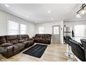 Open-concept living room with hardwood floors, large windows, and comfortable seating at 2333 Calhoun St, Indianapolis, IN 46203