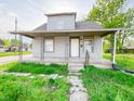 Charming two-story home with a covered porch and decorative iron railings at 274 Leeds Ave, Indianapolis, IN 46201
