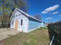 Exterior view of a house under construction showing Tyvek HomeWrap and framing at 3123 S Rybolt Ave, Indianapolis, IN 46241