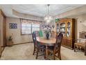 Traditional dining room with a chandelier, wooden furniture, and a decorative china cabinet at 500 Meadowlark Ct, Whiteland, IN 46184