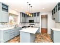 Modern kitchen with gray cabinets, white countertops, and stylish backsplash at 6164 Parrington Dr, Indianapolis, IN 46236