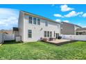 Spacious backyard with a patio, lush grass, and a privacy fence, perfect for outdoor living and entertaining at 6827 Fallen Leaf Dr, Whitestown, IN 46075