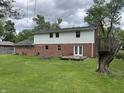 Brick two story home with spacious backyard and wooden deck at 7140 Avalon Trail Dr, Indianapolis, IN 46250