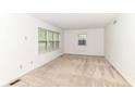 Bright, carpeted bedroom with ample natural light from two windows, creating a cozy and inviting space at 7140 Avalon Trail Dr, Indianapolis, IN 46250