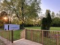 View of a backyard and shed from a wood deck at this property at 728 W 300 N, Anderson, IN 46011