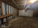 Spacious unfinished two car garage with a workbench, perfect for storage or projects at 9118 Lansburgh Ct, Indianapolis, IN 46234