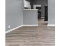 Open-concept design with neutral paint, and seamless flow from living to kitchen space at 917 S Grant St, Muncie, IN 47302