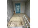 Covered entryway with a blue front door and accessibility features at 1102 Branifield Ct, Franklin, IN 46131