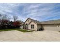 Charming single-story home with a stone facade, a two-car garage and a spacious driveway at 16924 Maple Springs Way, Westfield, IN 46074