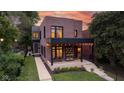 Beautiful two-story home with a covered porch perfect for relaxing, complemented by a manicured lawn at 1907 N Alabama St, Indianapolis, IN 46202