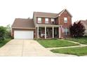 Charming two-story brick home with a well-manicured lawn and attached two car garage at 2120 Dakota Dr, Franklin, IN 46131