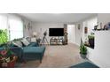 Cozy living room featuring modern furniture, a large TV, and ample space for relaxation at 2610 S Sheridan Ave, Indianapolis, IN 46203