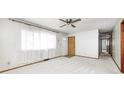 Bright living room with a ceiling fan, plush carpeting, and a window, offering a cozy atmosphere at 3913 E Cr 600 S, Clayton, IN 46118