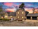 Brick home featuring an inviting outdoor patio area, an attached two-car garage, and manicured landscaping at 4155 S State Rd 39, Lebanon, IN 46052