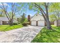 Charming home featuring a well-manicured lawn and a two-car garage with brick detailing at 4322 Matrea More Ct, Indianapolis, IN 46254