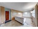 Living room with wood paneling and large window at 476 Southgate Dr, Greenwood, IN 46143
