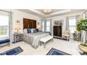 Spacious main bedroom features a tray ceiling, elegant furnishings, and an abundance of natural light at 5158 Montview Way, Noblesville, IN 46062