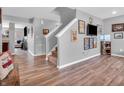 Spacious living room with hardwood floors, staircase, and plenty of natural light at 546 Freedom Dr, Pittsboro, IN 46167