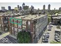 Brick building exterior with downtown skyline view; large windows provide ample natural light at 624 E Walnut St # 46, Indianapolis, IN 46204