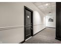 Hallway of the property with carpeting, painted walls, and door number 46 at 624 E Walnut St # 46, Indianapolis, IN 46204
