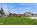 Spacious backyard featuring a well-maintained lawn and wood deck at 828 N 13Th St, Elwood, IN 46036