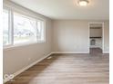 Bright living room featuring beautiful flooring and large windows at 828 N 13Th St, Elwood, IN 46036