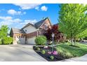 Lovely two-story brick home with a three-car garage and beautifully landscaped yard at 11341 Abercairn Ct, Zionsville, IN 46077