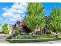 Charming two-story brick home featuring mature landscaping and a well-maintained lawn at 11341 Abercairn Ct, Zionsville, IN 46077