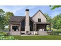 Backyard of home featuring stone fireplace and patio with outdoor seating under covered porch at 1509 Chatham Rdg Ct, Westfield, IN 46074