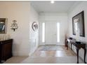 Bright foyer with tile floors, a front door with sidelights, and neutral decor at 16204 Oakford Trl, Fishers, IN 46037