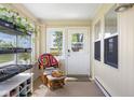 Cozy sun room with natural light, comfortable seating, and views of the outdoors, perfect for relaxation at 1840 W 100 N, Columbus, IN 47201