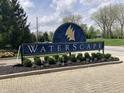 Landscaped entrance sign for Waterscape community with decorative flowers and shrubbery at 20776 Waterscape Way, Noblesville, IN 46062